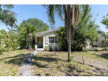 Charming single-story home surrounded by mature trees and lush landscaping at 627 38Th Ne Ave, St Petersburg, FL 33704