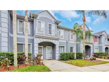 Charming townhouse with well-manicured landscaping, private entrance, and neutral-toned exterior at 18228 Paradise Point Dr, Tampa, FL 33647