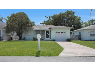 Charming home with a well-maintained lawn, a mailbox, and a single-car garage at 5000 18Th S Ave, Gulfport, FL 33707
