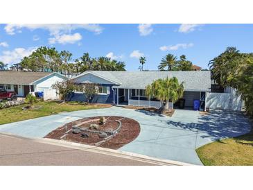 Charming single-story home features a well-manicured yard, inviting curb appeal, and a spacious driveway at 7919 Causeway S Blvd, St Petersburg, FL 33707