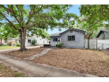 Charming single-story home featuring mature trees and a cozy front yard in a quiet neighborhood setting at 4102 Haines N Rd, St Petersburg, FL 33703
