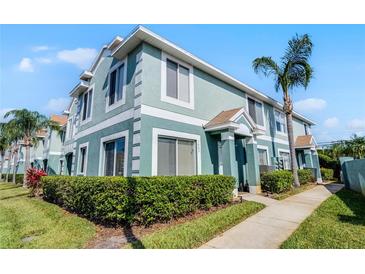 Charming townhome featuring a well-maintained exterior, lush landscaping, and a welcoming entrance at 1601 Fluorshire Dr, Brandon, FL 33511