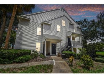 Charming condo featuring well-maintained landscaping and a welcoming entrance, perfect for comfortable living at 3261 Haviland Ct # 303, Palm Harbor, FL 34684