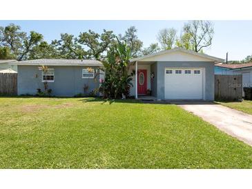 Charming single-story home with a well-manicured lawn and an attached garage, creating a welcoming curb appeal at 3066 19Th Sw Pl, Largo, FL 33774