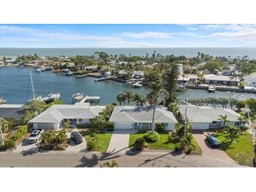 Stunning waterfront home featuring lush landscaping, multiple docks and incredible Gulf views at 2540 S Shore Se Dr, St Petersburg, FL 33705