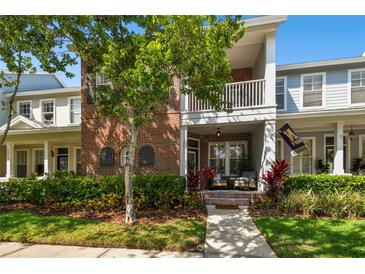 Charming home with a brick facade, lush landscaping, and a cozy porch area perfect for relaxing at 10011 Parley Dr, Tampa, FL 33626