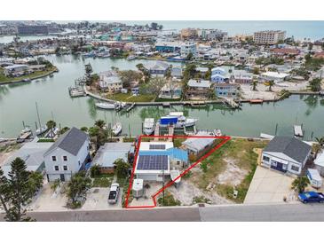Waterfront home in a neighborhood with boat docks, canal access, and water views at 301 Boca Ciega Dr, Madeira Beach, FL 33708