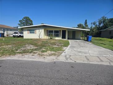 Charming single-story home with a covered carport and a well-maintained front yard at 125 18Th Nw St, Ruskin, FL 33570