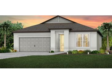 Beautiful single-story home showcasing a well-manicured lawn and a two-car garage at 9753 Redwood Heights Loop, Thonotosassa, FL 33592