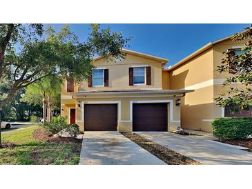 Two-story townhome with a two-car garage and manicured lawn at 2837 Santego Bay Ct, Brandon, FL 33511