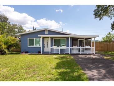 Charming single-story home with a welcoming front porch and manicured lawn at 4507 26Th S Ave, Tampa, FL 33619