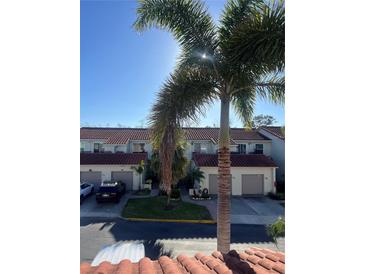 Well-maintained townhomes with garages and lush landscaping, creating a welcoming neighborhood ambiance at 2700 Bayshore Blvd # 519, Dunedin, FL 34698