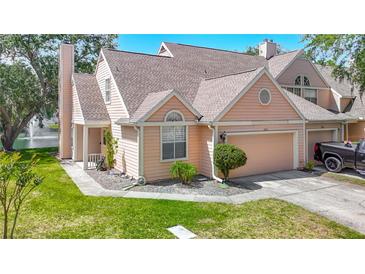 Charming two-story townhome with a well-manicured lawn and a single-car garage in a desirable neighborhood at 3611 Pine Knot Dr, Valrico, FL 33596
