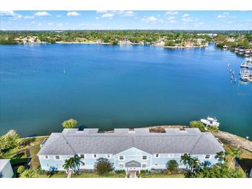 Stunning aerial view of waterfront property, showcasing its beautiful architecture and serene coastal setting at 5007 Starfish Se Dr # A, St Petersburg, FL 33705