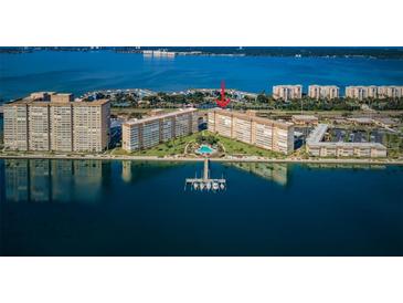 Stunning aerial view of waterfront condos with a private pool and boat dock at 5108 Brittany S Dr # 607, St Petersburg, FL 33715
