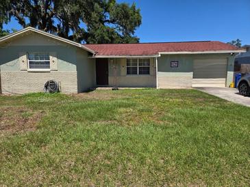 Charming single-story home with a well-maintained lawn and a cozy, inviting facade at 111 Inwood Cir, Brandon, FL 33510