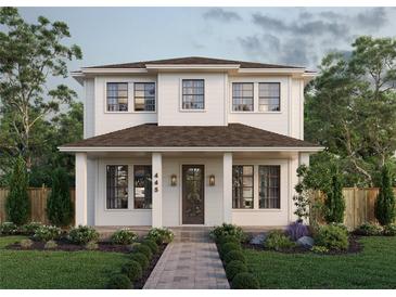 Charming two-story home with a welcoming front porch, landscaped garden, and beautiful curb appeal at 445 36Th N Ave, St Petersburg, FL 33704