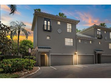 Charming multi-story townhome with attached garages and a well-manicured landscape at 501 Knights Run Ave # 5101, Tampa, FL 33602
