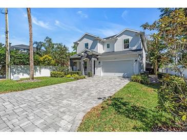 Beautiful two-story home with a charming facade and manicured landscaping at 4251 W Roland St, Tampa, FL 33609
