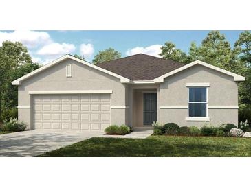 Charming single-story home with a two-car garage, neutral tones, and well-maintained landscaping at 13434 Tropical Breeze Way, Hudson, FL 34669