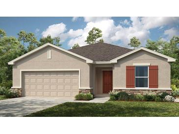 Charming single-story home featuring a two-car garage, neutral stucco exterior, and a well-manicured lawn at 13478 Tropical Breeze Way, Hudson, FL 34669