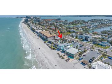 Breathtaking aerial view of the beautiful beachside home, showcasing the stunning coastline and surrounding neighborhood at 2800 Gulf Blvd Unit # 1A, Belleair Beach, FL 33786