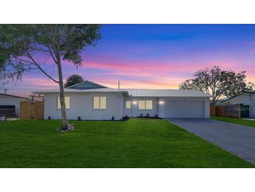Charming single-story home featuring a freshly painted exterior, updated landscaping, and a spacious front yard at 3404 33Rd Street W Ct, Bradenton, FL 34205
