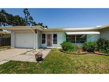 Charming single-story home featuring a well-maintained lawn and inviting curb appeal at 1524 Lemon St, Clearwater, FL 33756