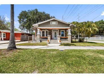 Charming single-story home with a welcoming front porch and well-manicured lawn at 2224 Gordon St, Tampa, FL 33605