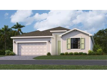 Charming single-story home with light siding, a two-car garage, and fresh landscaping at 3547 Night Star Ter, Parrish, FL 34219
