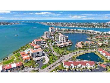 Beautiful aerial view of waterfront condos, meticulously landscaped grounds, and stunning ocean views at 6357 Bahia Del Mar Blvd # 111, St Petersburg, FL 33715