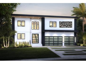 Stunning modern two-story home with a clean white facade, black trim, and a two-car garage at 3420 Channelside Ct, Safety Harbor, FL 34695