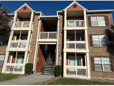 Multi-story condo building featuring balconies and brick facade, offering comfortable community living at 10200 Gandy N Blvd # 1133, St Petersburg, FL 33702
