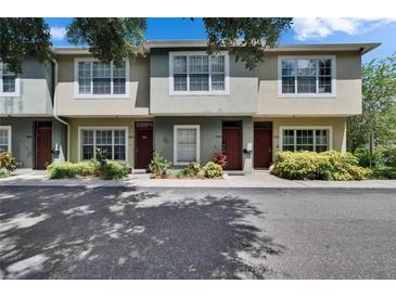Charming townhouses with well-kept landscaping and large windows for ample natural light at 5864 Nature Terrace Cv, Tampa, FL 33617
