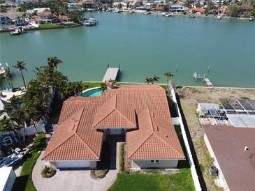 Stunning waterfront property with a private pool, dock, and lush landscaping at 8053 13Th S Ave, St Petersburg, FL 33707