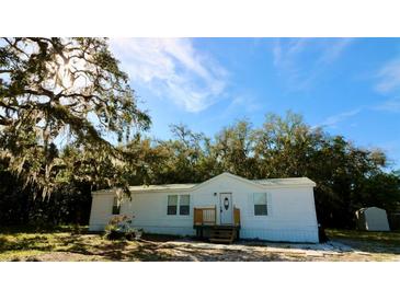 Charming single-story home with a well-maintained exterior and inviting front porch at 9161 Codel Loop, New Port Richey, FL 34654