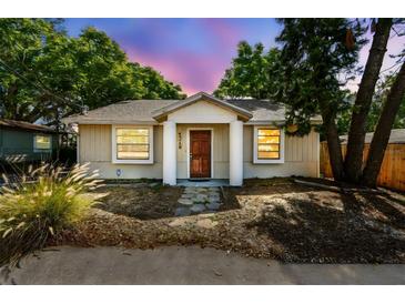 Charming bungalow featuring a well-kept front yard and inviting entryway at 1219 Michigan N Dr, Dunedin, FL 34698