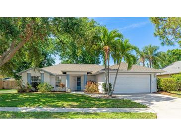 Charming single-story home with lush landscaping and a well-manicured front yard at 2314 50Th E Dr, Bradenton, FL 34203