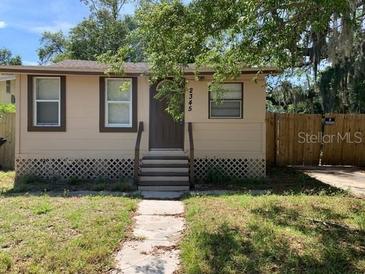 Charming single-story home with a cozy front yard and traditional architectural details at 2345 Kingston S St, St Petersburg, FL 33711