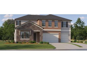 A stone and stucco two-story home with a two-car garage, and a well manicured lawn at 9616 Runaway Breeze Dr, Land O Lakes, FL 34637