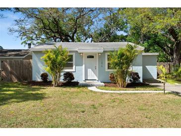 Charming single-story home featuring a well-maintained lawn and inviting front entrance, enhanced by lush landscaping at 1276 Bertland Way, Clearwater, FL 33755