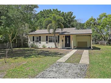 Charming single-story home with a cozy carport and well-maintained front yard, enhanced by a palm tree at 249 41St Ne Ave, St Petersburg, FL 33703