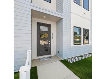 Modern home featuring a stylish front door and manicured landscaping at 2810 N Florida Ave, Tampa, FL 33602