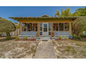 Charming home featuring a welcoming front porch and well-maintained landscaping at 2835 Dartmouth N Ave, St Petersburg, FL 33713