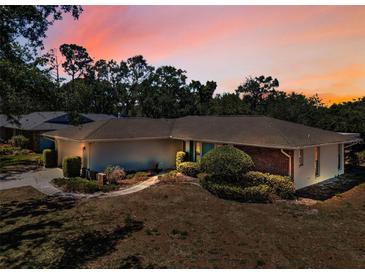 Charming single-story home featuring a brick accent, manicured landscaping, and a cozy, inviting curb appeal at 2700 Westchester N Dr, Clearwater, FL 33761