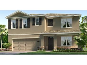 Two-story home featuring a neutral color palette, shutters, a two-car garage, and a welcoming front porch at 3332 Ivy Hollow Dr, Plant City, FL 33565