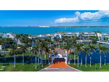 Stunning aerial view of beachfront condos with palm trees and beautiful water views at 5155 Isla Key S Blvd # 304, St Petersburg, FL 33715