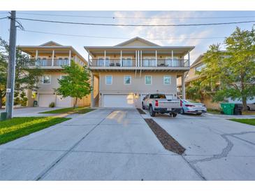 Beautiful townhouse with a large driveway and dual balconies overlooking the neighborhood at 6822 Kissimmee St # 8-B, Tampa, FL 33616