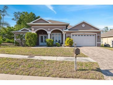 Charming single-Gathering home with a well-manicured lawn and a two-car garage, perfect for suburban living at 9127 Irondale Ln, Hudson, FL 34667