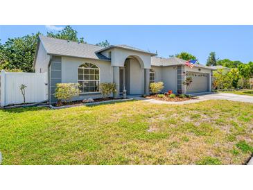 Charming single-story home with a well-maintained lawn and inviting front entrance at 7080 Nicole Ln, Largo, FL 33771